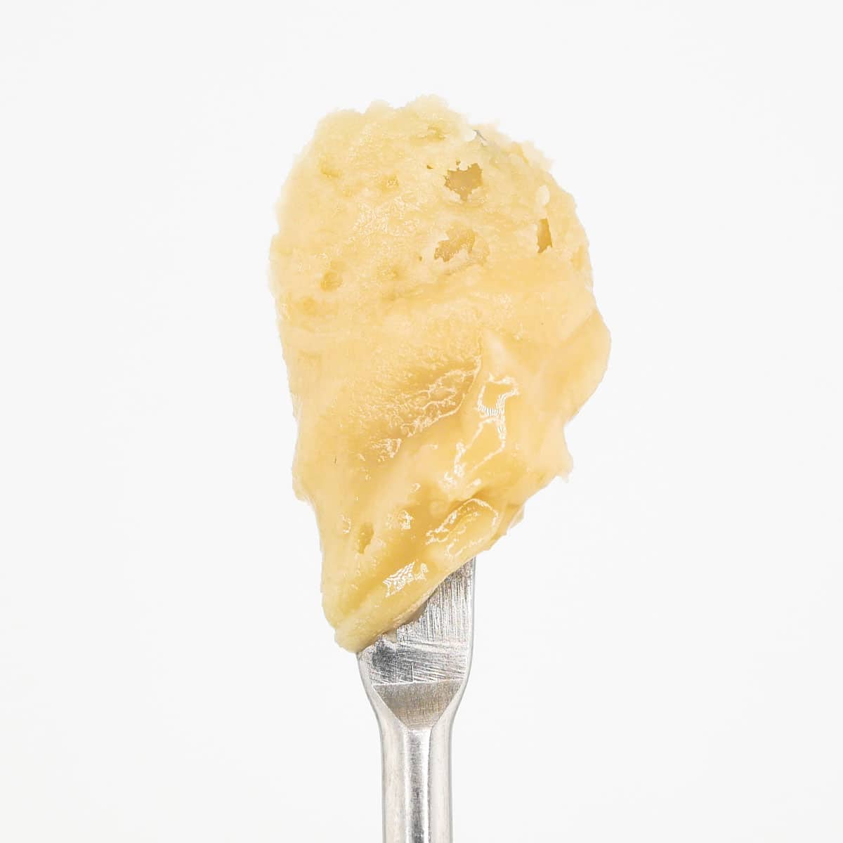 THCa cannabis concentrate on a metal spoon, high-quality extract for medical use.