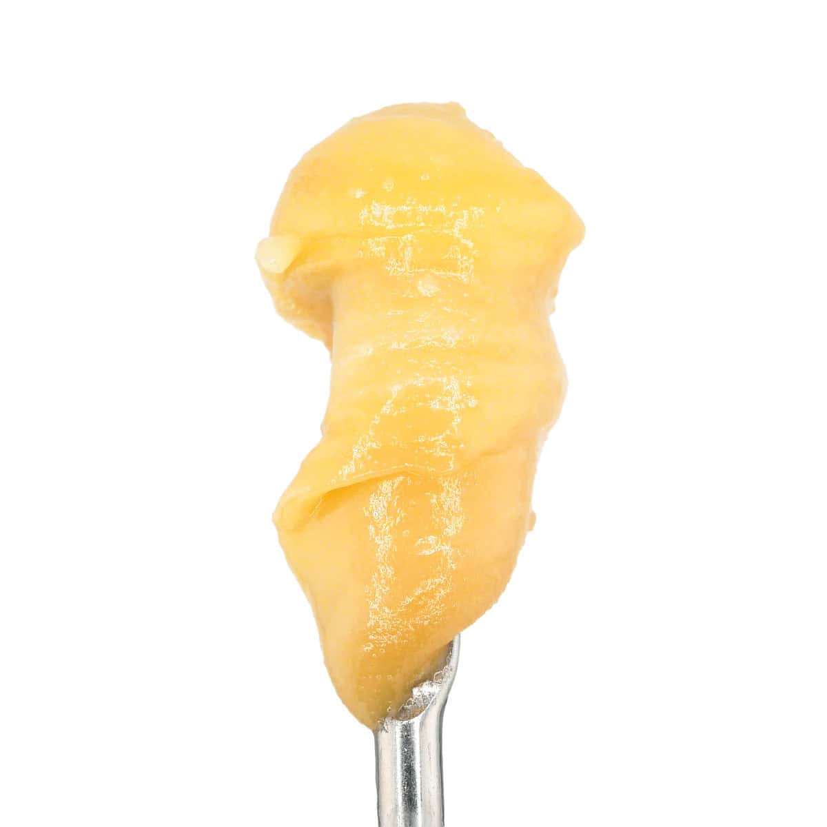 Close-up of Cookie Dough flavored THCa concentrate on a metal tool.